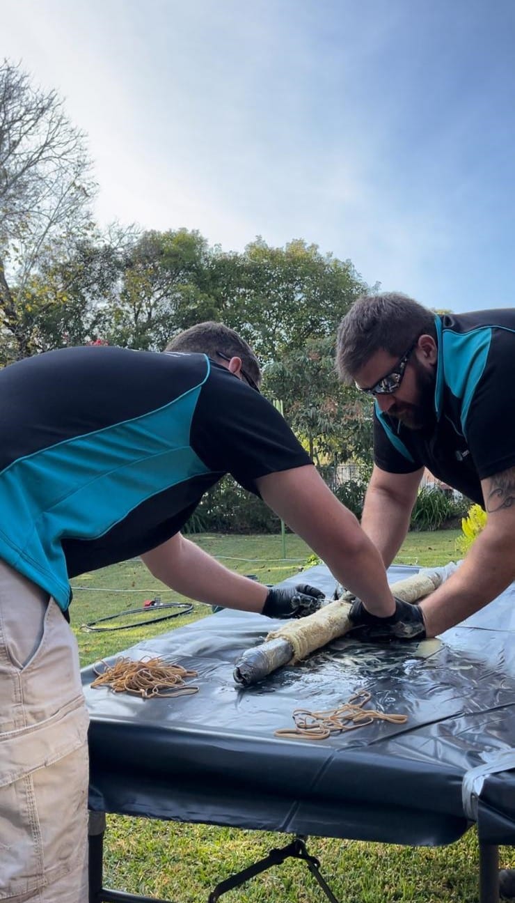 plumbers with cameras inspecting a pipe for relining in sydney
