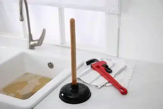 Blocked drain Tools used by a cheap plumber to unblock a kitchen drain