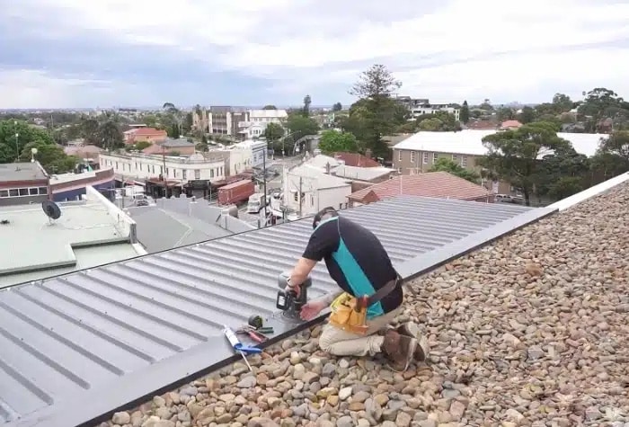 Roof-plumber A skilled roof plumber expertly repairing and maintaining a local home to prevent potential leaks and ensure lasting protection.