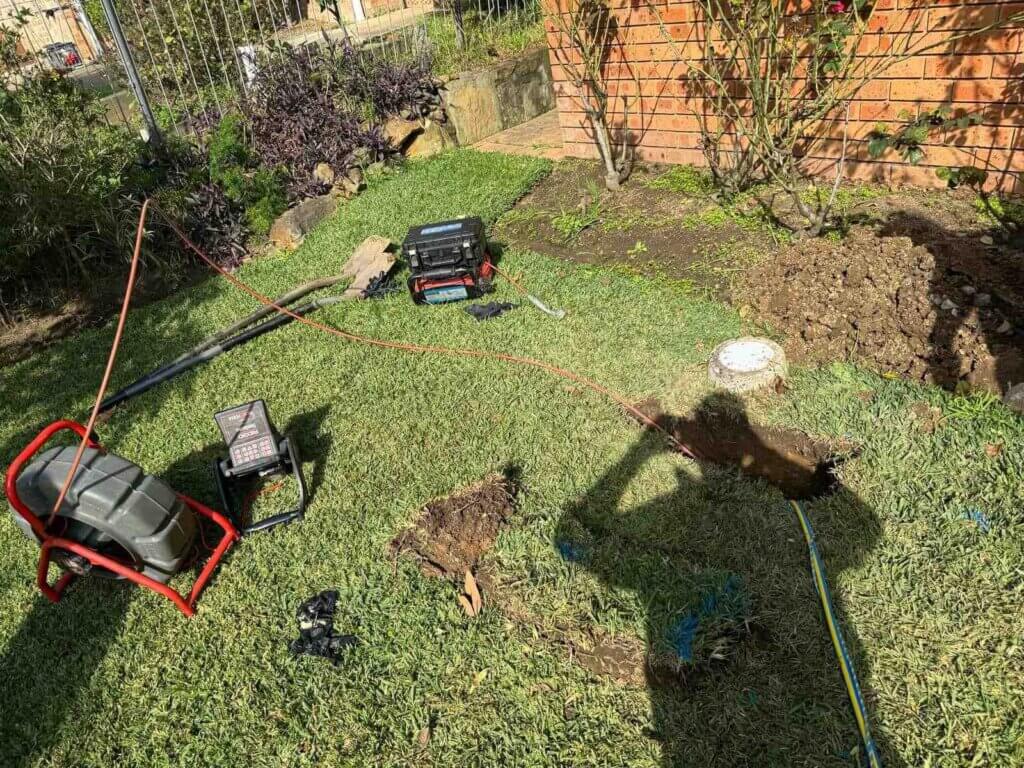 Trenchless-Pipe-Relining-Sydney-The-Clean-Plumber-3 plumbers with cameras inspecting a pipe for relining in sydney