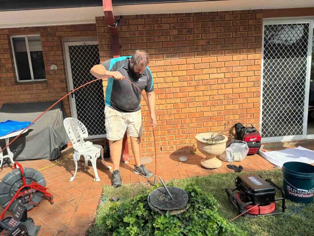 Trenchless-Pipe-Relining-Sydney-The-Clean-Plumber-6 cheap Plumber inspecting a drain for pipe relining services