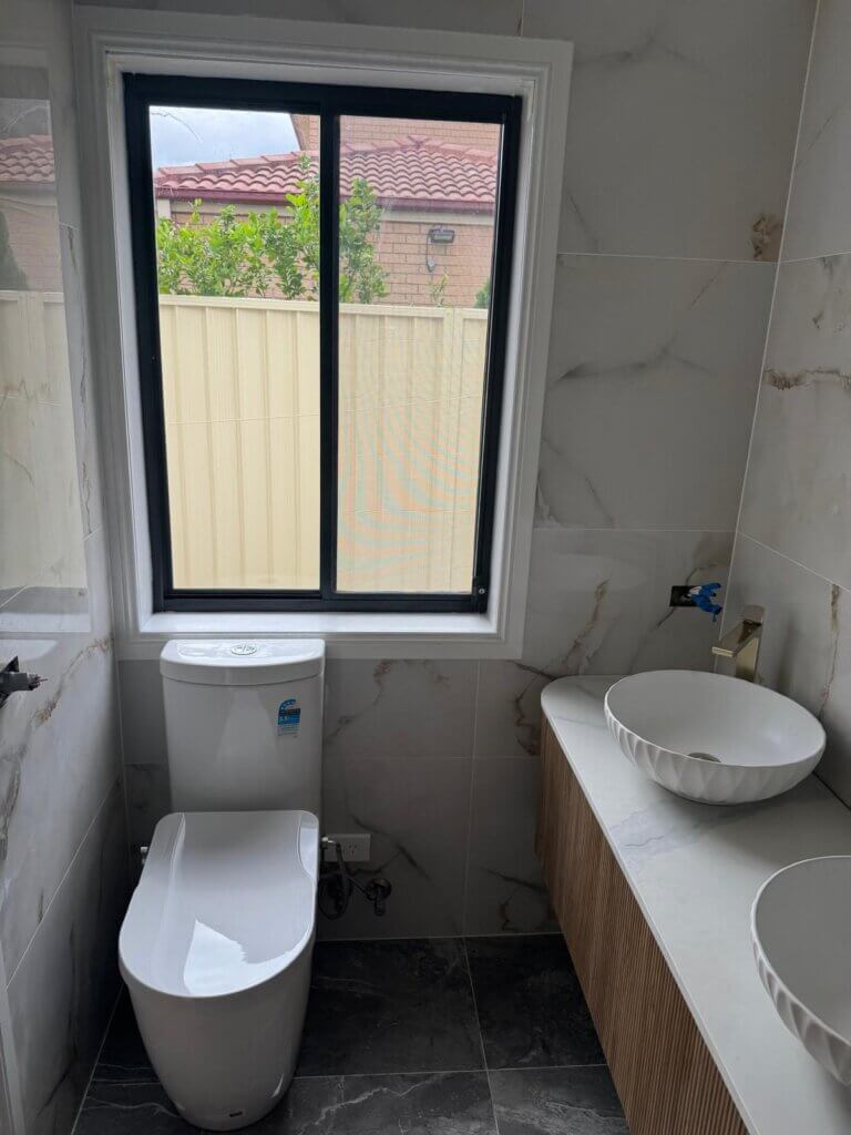 Design a practical yet stylish space with durable materials, ample storage, and easy-to-clean surfaces for busy households.