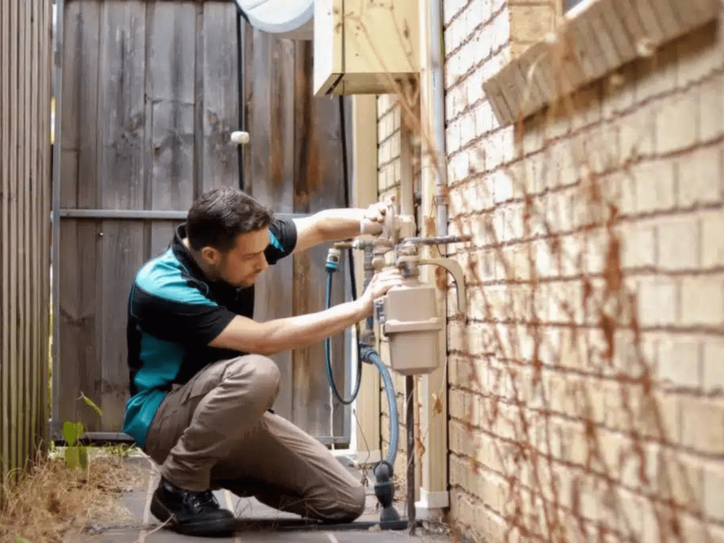 Image of a professional plumber completing plumbing services in the hills district